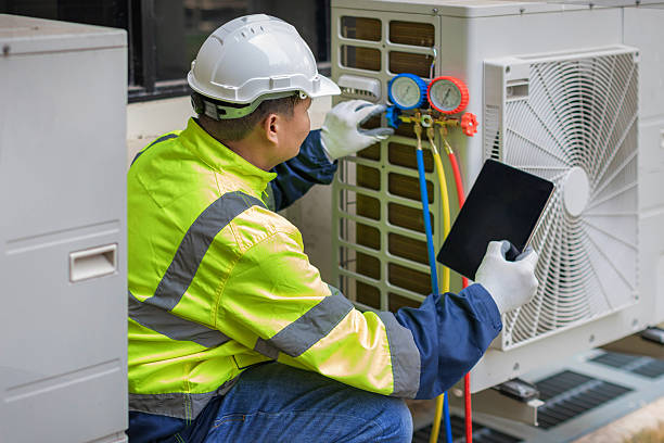 Professional Heat Pump Repair technician working in Gurley, AL